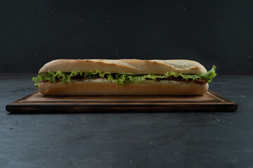 Delicious ham and greens sandwich, close up