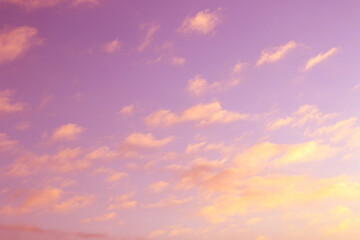 Naklejka na ściany i meble abstract purple sky with yellow clouds