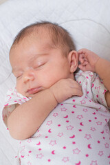 Cute, small and adorable newborn baby girl sleeping