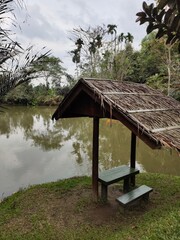 Medan, Indonesia - March 10, 2021: Little Shack House on the edge of the lake, Medan City, Indonesia.