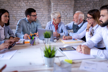 Corporate business team and manager on meeting in office