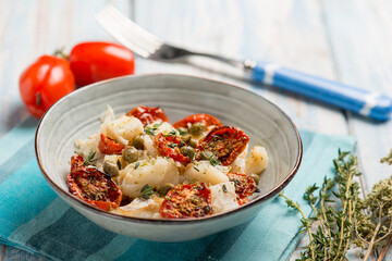 salad with baccala dried tomatoes and capers