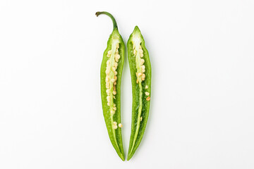 Green chilli on white background