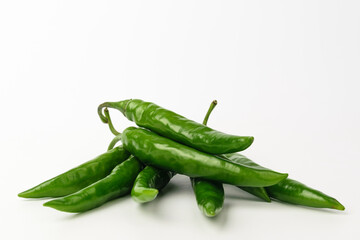 Green chilli on white background