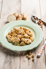 Fototapeta premium chicken roasted with hazelnut and fresh ginger