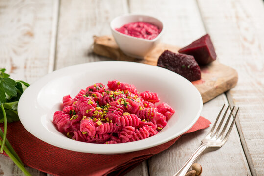 pasta with beet pesto and pistachio nuts