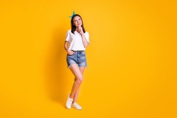 Fototapeta na wymiar Full body photo of brown haired fit young woman hold hand chin pocket look empty space isolated on shine bright color background