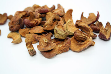 Apples dried on the stove. White background.