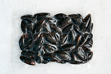 Frozen mussels in vacuum packaging.