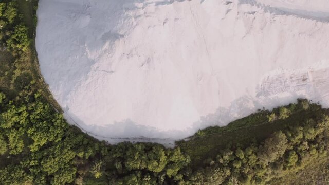 White sands by the forest. Top down shot of white desert. Beautiful, natural landscape. Background scene of a natural scenery.