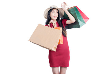 Asian woman with hat carrying shopping bags