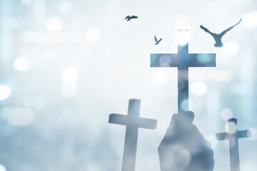 Human hand holding Christian Cross and pigeon flying