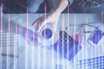 Double exposure of man and woman working together and financial chart hologram drawing. market analysis concept. Computer background. Top View.