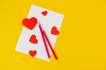 14 february holiday birthday greeting card hearts on a white wooden background with space for text flat lay pencil
