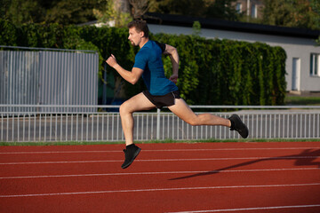 Athletic guy doing running workout