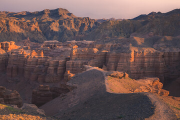 Rugged sunset or sunrise view of badlands landscape and terrain in Charyn Canyon National Park in the Almaty Province of Kazakhstan.