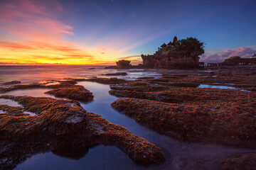 Tanah Lot Temple in sunset time, the most famous temple on the sea at Bali island, Indonesia