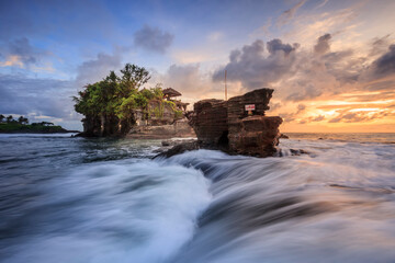 Tanah Lot Temple in sunset time, the most famous temple on the sea at Bali island,Indonesia
