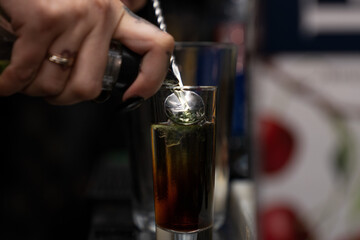 pouring champagne into glass