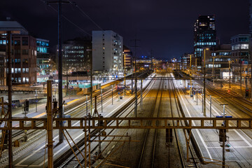 Night view of Zurich Altstetten train station in front of Zurich city