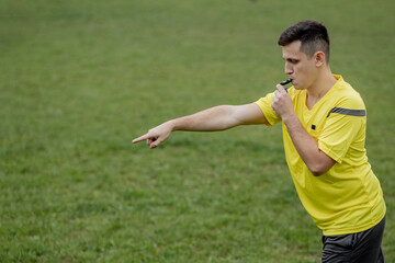 Referee showing on penalty while gaming. Concept of sport, rules violation, controversial issues,...