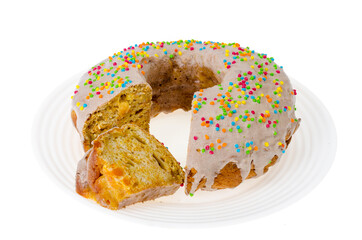 Homemade carrot cake with icing and colored sprinkles