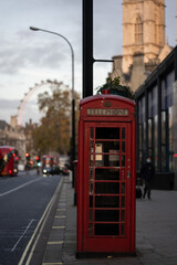 Fototapeta na wymiar Telephone Box in front of the London Eye