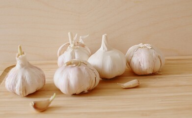 garlic heads on the board before cooking