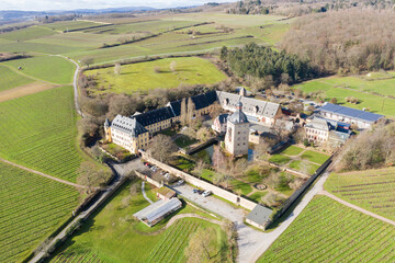 Bird's eye view of Vollrads Castle near Oestrich-Winkel/Germany on a snow-free, sunny winter day 