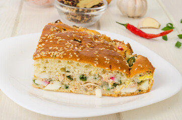 Homemade pie with boiled egg and green onions