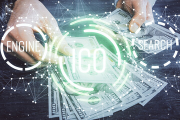 Multi exposure of blockchain theme drawing hologram and USA dollars bills and man hands. Business concept.