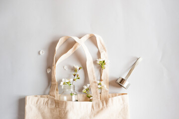 Zero waste shopping concept - cotton bag, glass bottle for water