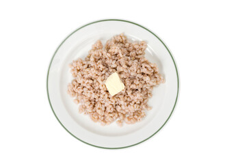 Porridge, boiled pearl barley on plate on white background