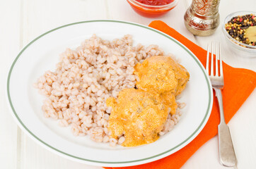 Pearl barley with meat balls. Studio Photo