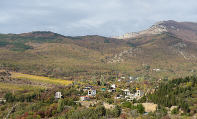 Gorgeous view of the high green mountains with houses. Discover the world of beauty.