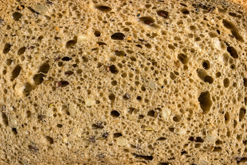Texture of fresh homemade rye bread with seeds. Concept - healthy food, homemade bread recipes.