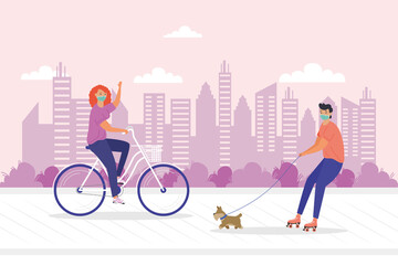 young couple wearing medial mask in bicycle and skates with dog
