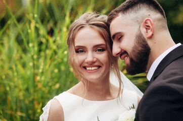 Fototapeta premium newlyweds are walking in the garden