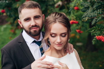 
newlyweds are walking in the garden