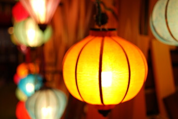 Night view of Colourful cloth lanterns lamp light shades hanging outside - ランタン 明かり 夜景