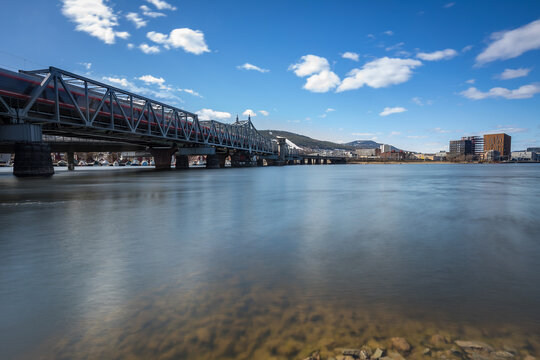 Railroad bridge in Drammen with a local train passing