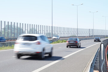The motorway is enclosed with acoustic screens. Barriers protect local residents from traffic noise.