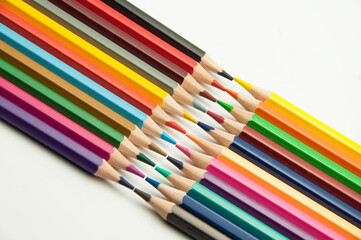 colored pencils on a white background. education concept. illustration of training.