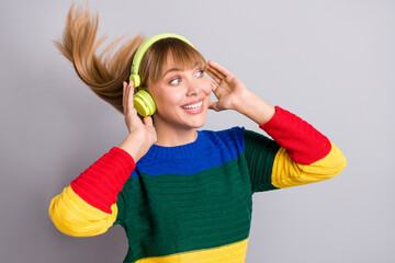 Photo portrait of female student listening music headphones enjoying smiling isolated on pastel...