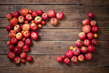 red apples on old wooden background