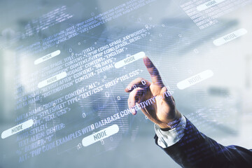 Multi exposure of programmer's hand clicks on abstract graphic coding sketch and world map on blurred office background, big data and networking concept