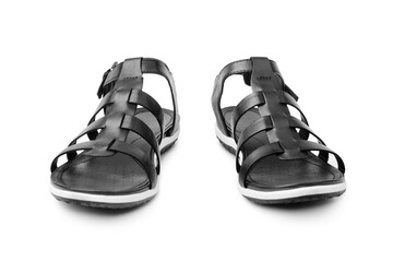 Black female sandals on white background isolated closeup front view, stylish woman sandal shoes with straps, pair of fashion leather summer sandals, two boots, casual walking footwear, urban footgear