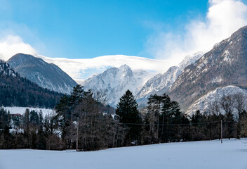 Winter landscape with snow and mountains in Triglav National Park, Slovenia.
