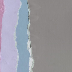 Colorful torn paper collage close-up. Texture made from various paper and cardboard parts. Damaged old paper background. Vintage blank wallpaper. Material design backdrop.