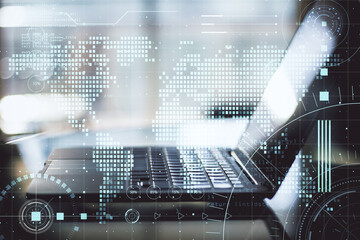 Work in progress concept with opened laptop and abstract digital screen with programming elements and world map. Double exposure.